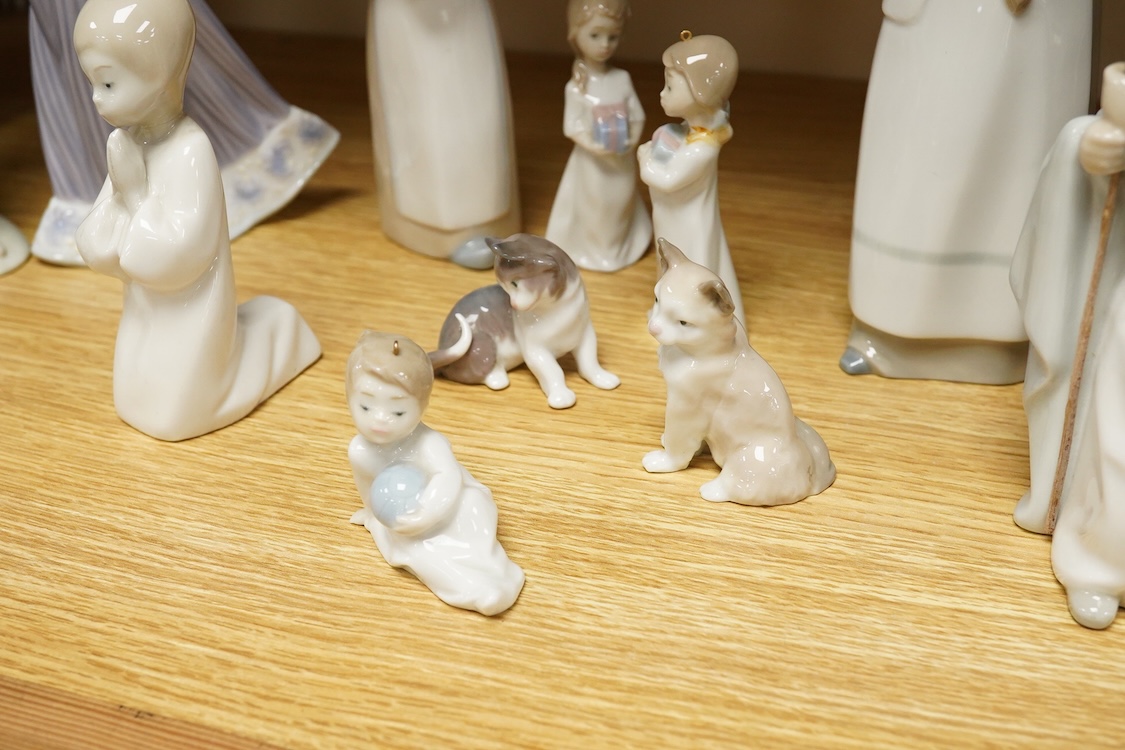 A group of twelve Lladro figures/animals, tallest 23cm